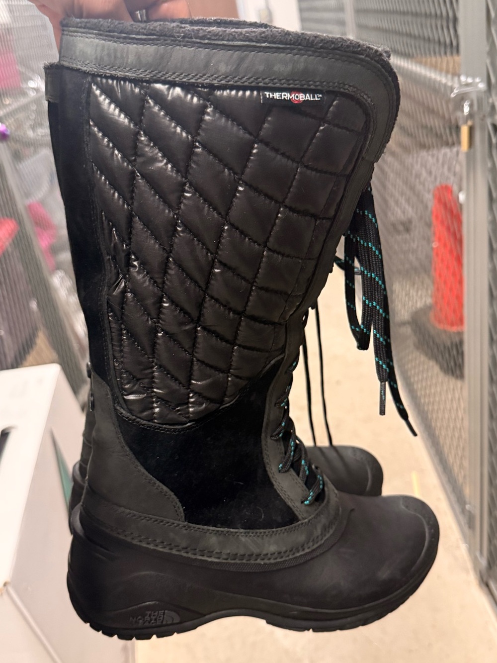 The North Face Black Quilted Lace-Up Thermoball Tall Boot with Teal Accents